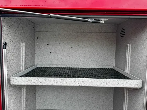 Lower tray extended from compartment showing non-slip pull-out surface.
